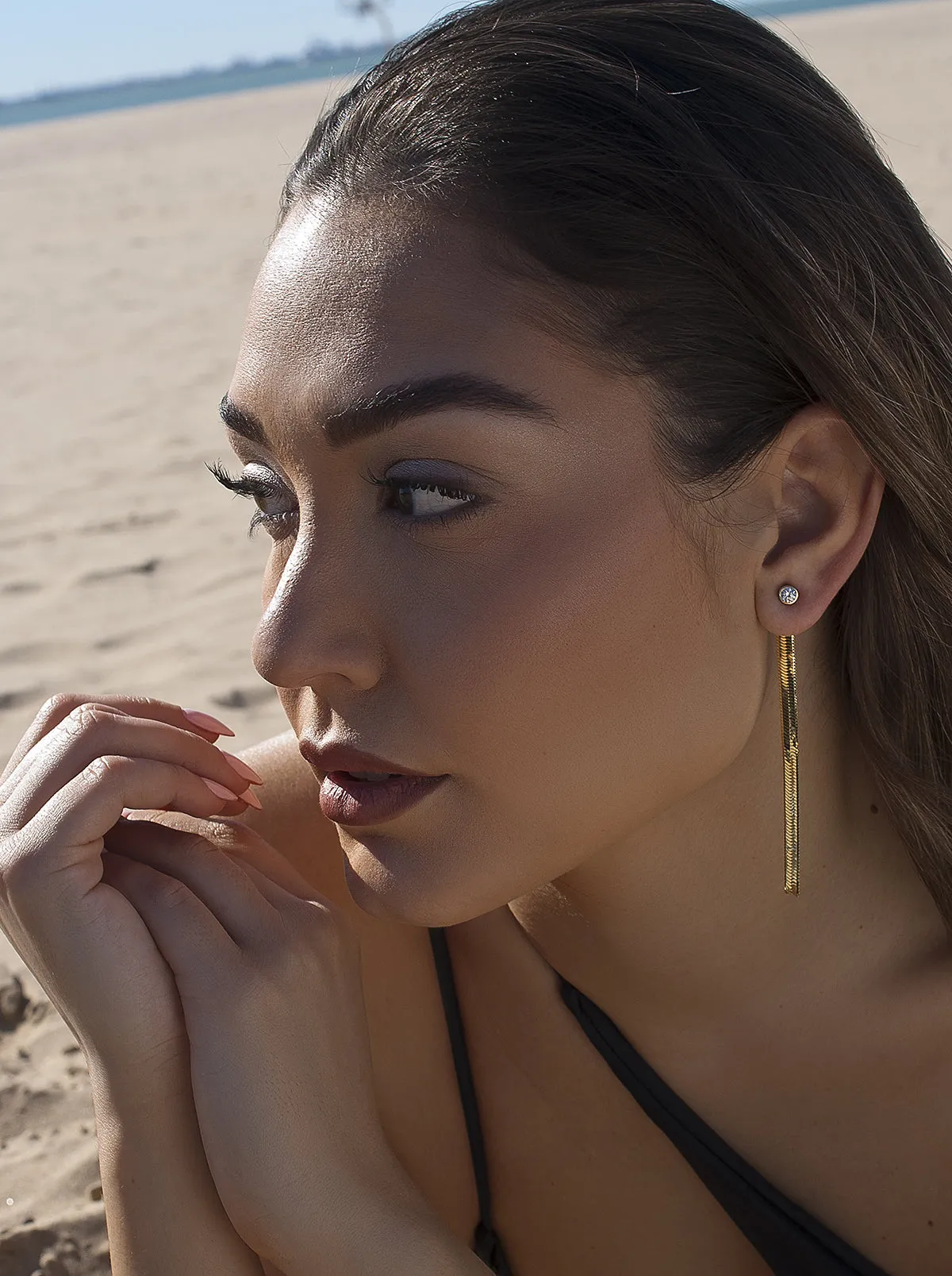 Pendientes largos plata baada en oro diseo snake con circonita