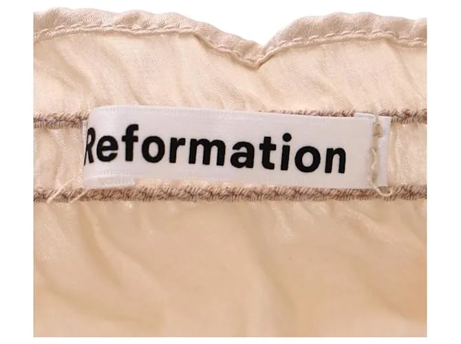 Top fruncido con volantes en seda color marfil Viviana de Reformation Blanco Crudo 